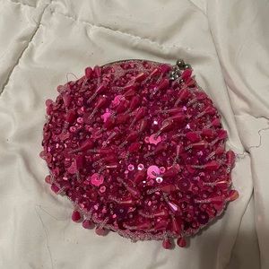 Cute Fuchsia colored beaded clutch.